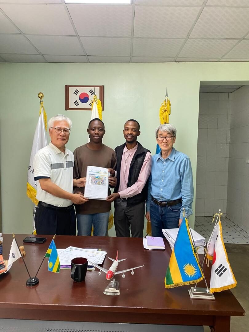 Neria and Parfait meeting the UAIT Vice Chancellor after returning from Korea