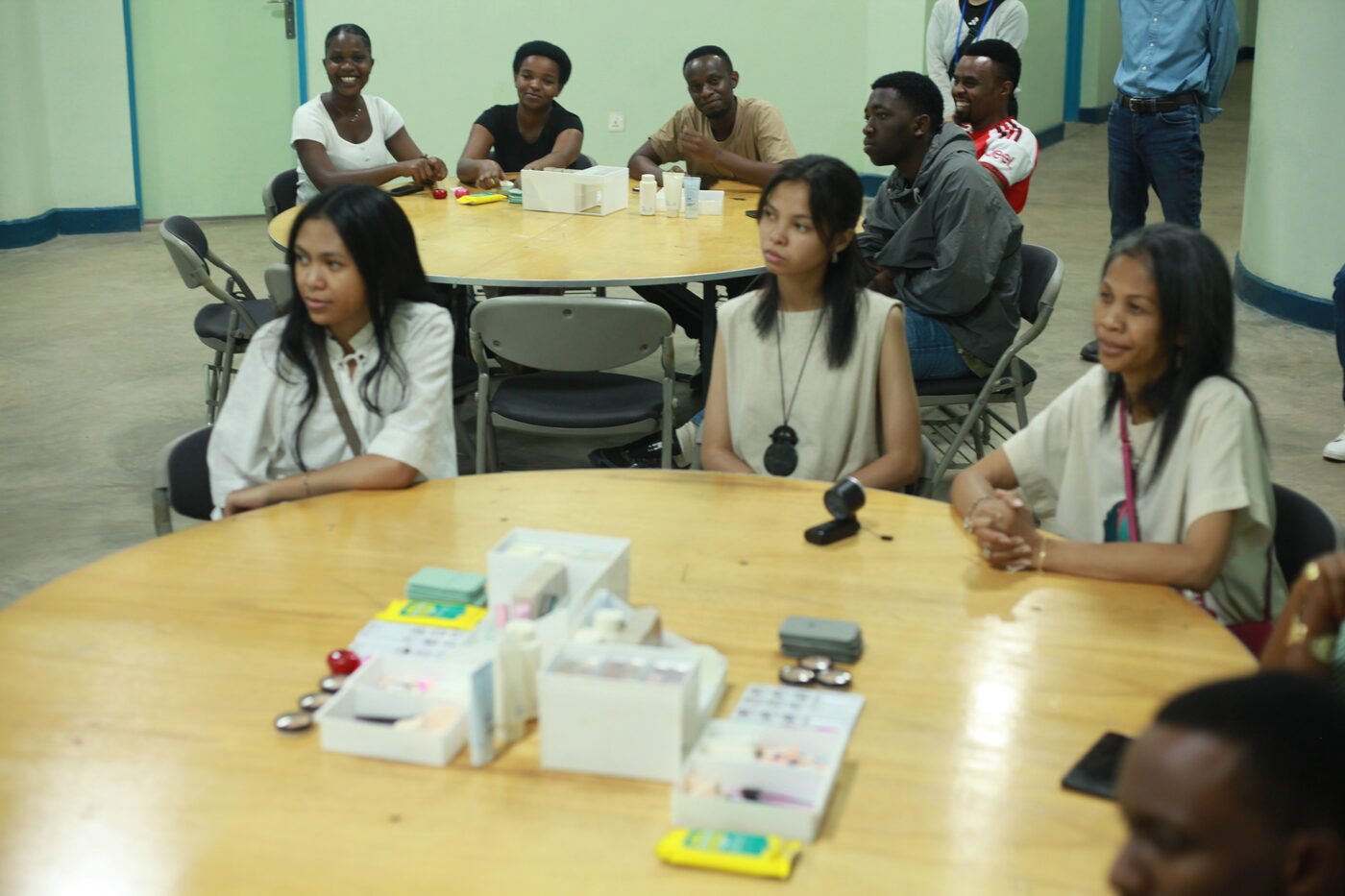 Participants at round tables during the K-Beauty session introduction