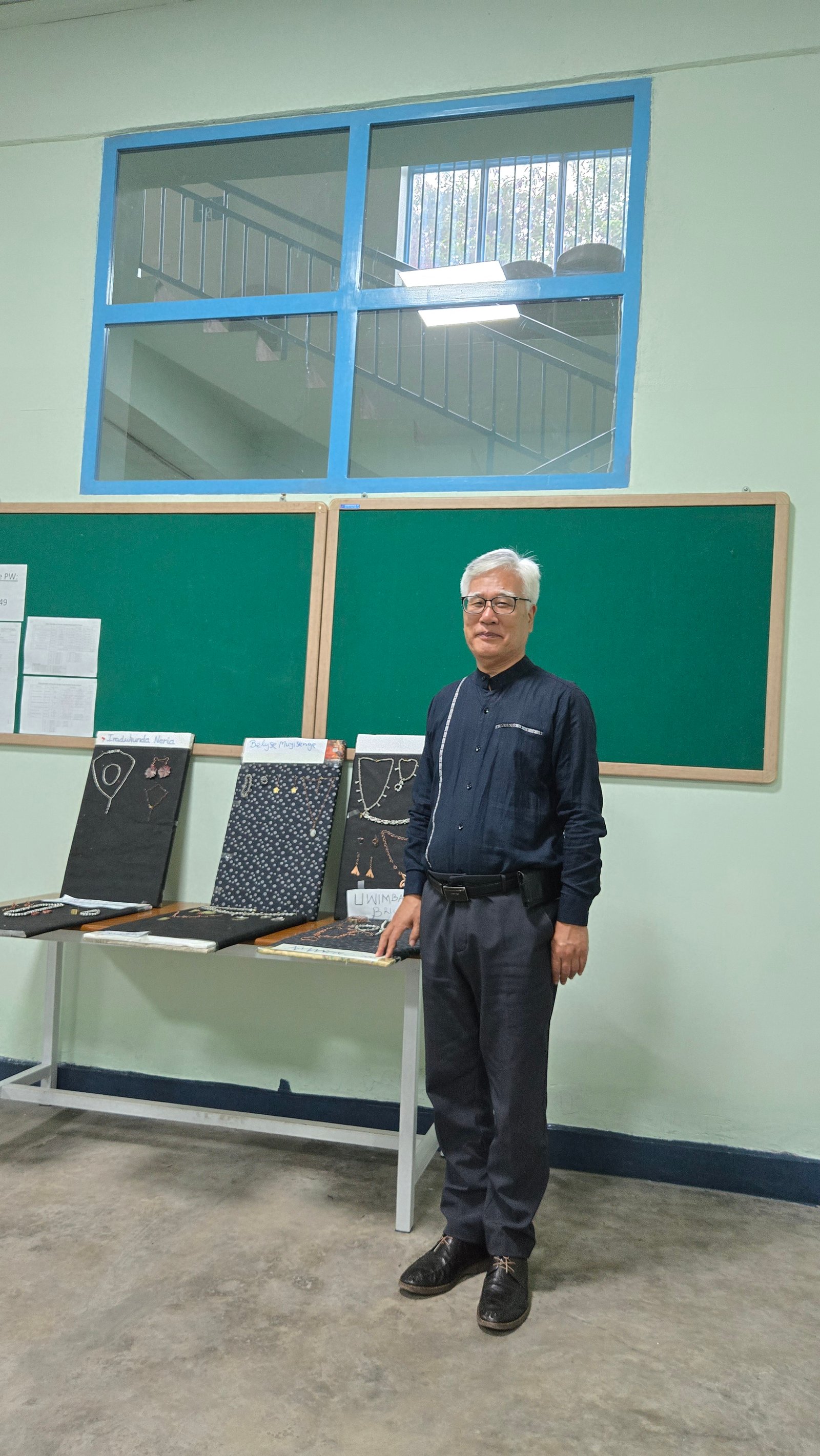 Professor with student portfolio collection