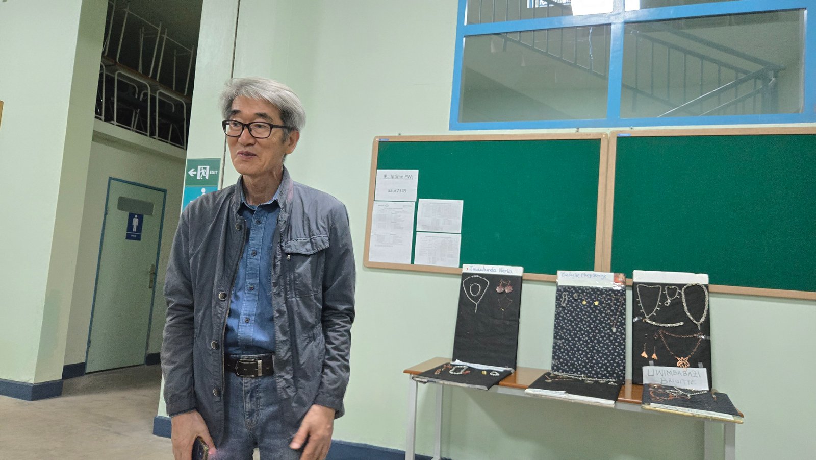 Faculty member with student jewelry displays