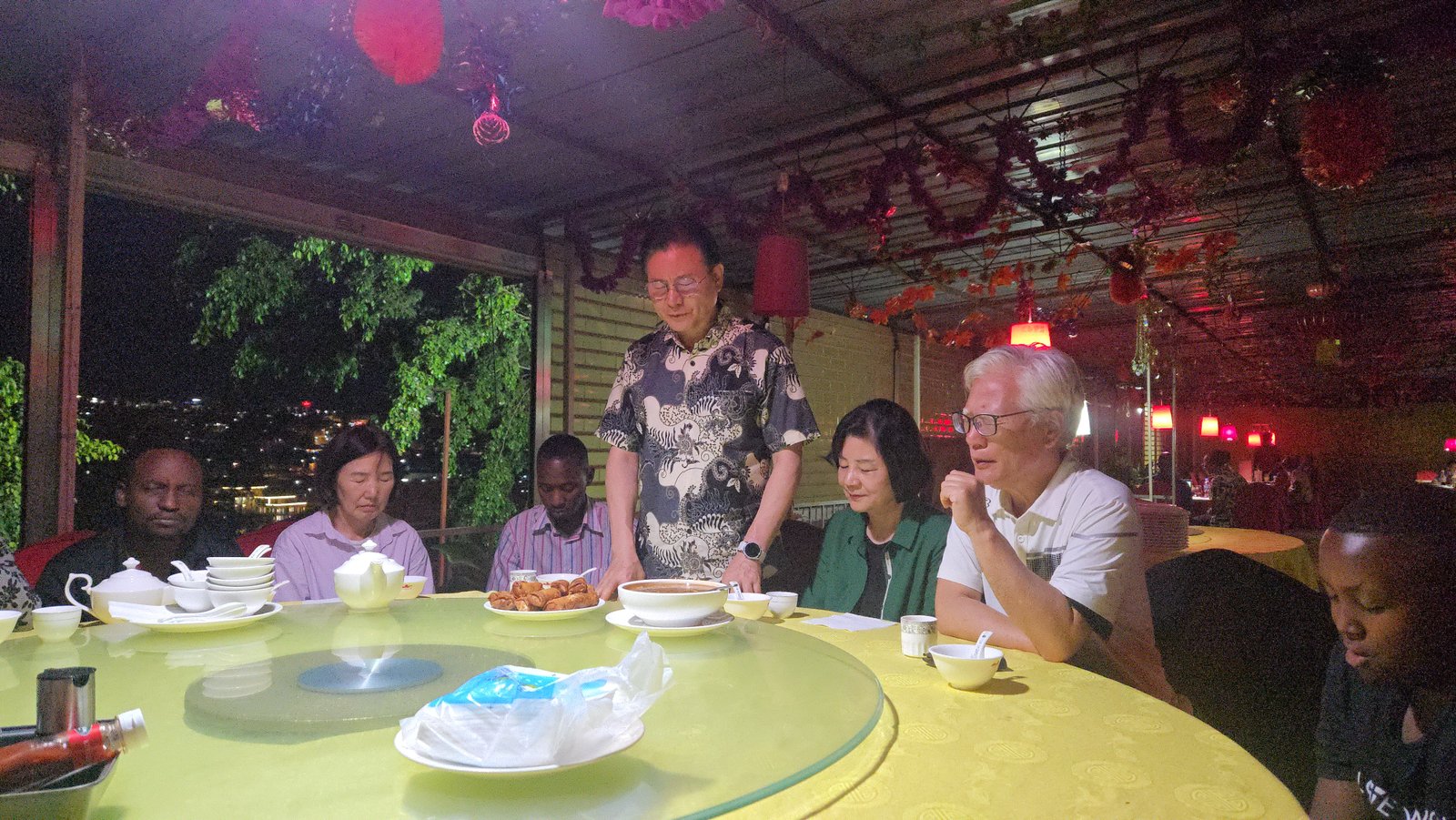Pastor Ryu Cheol-bae sharing prayer and fellowship during the Bugesera campus visit