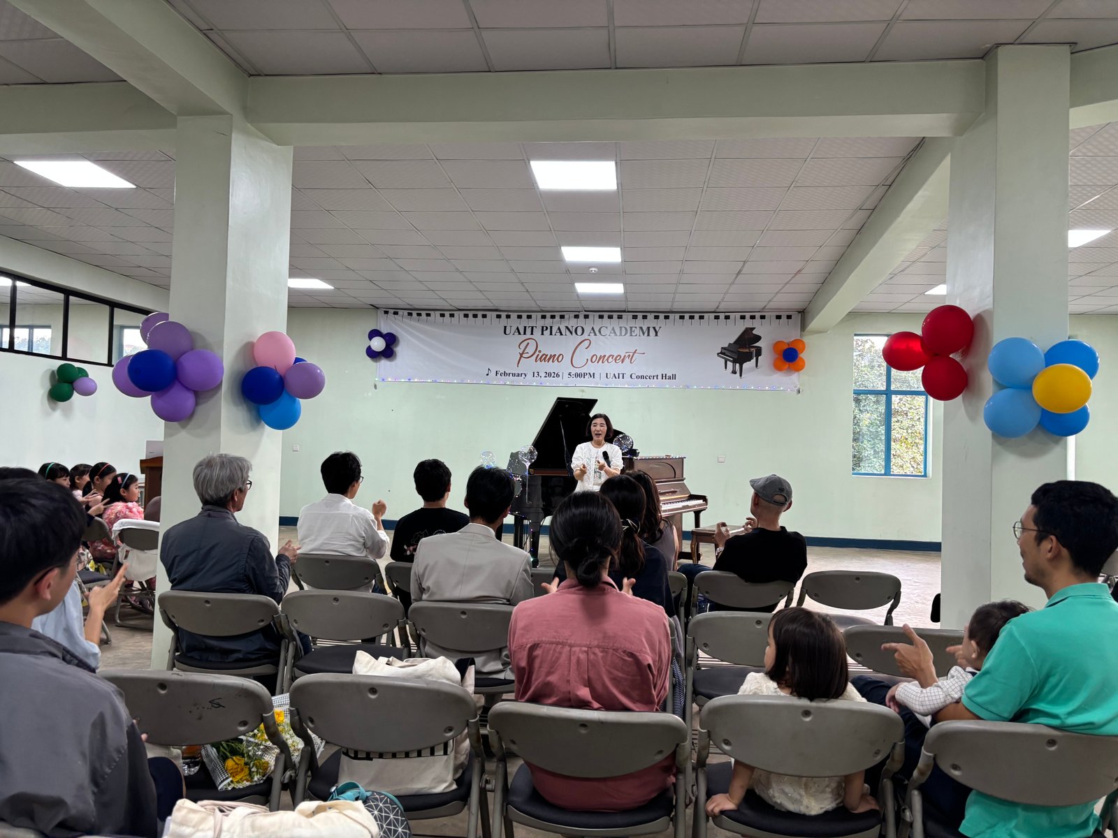UAIT Piano Academy Concert - audience enjoying performances at UAIT Concert Hall
