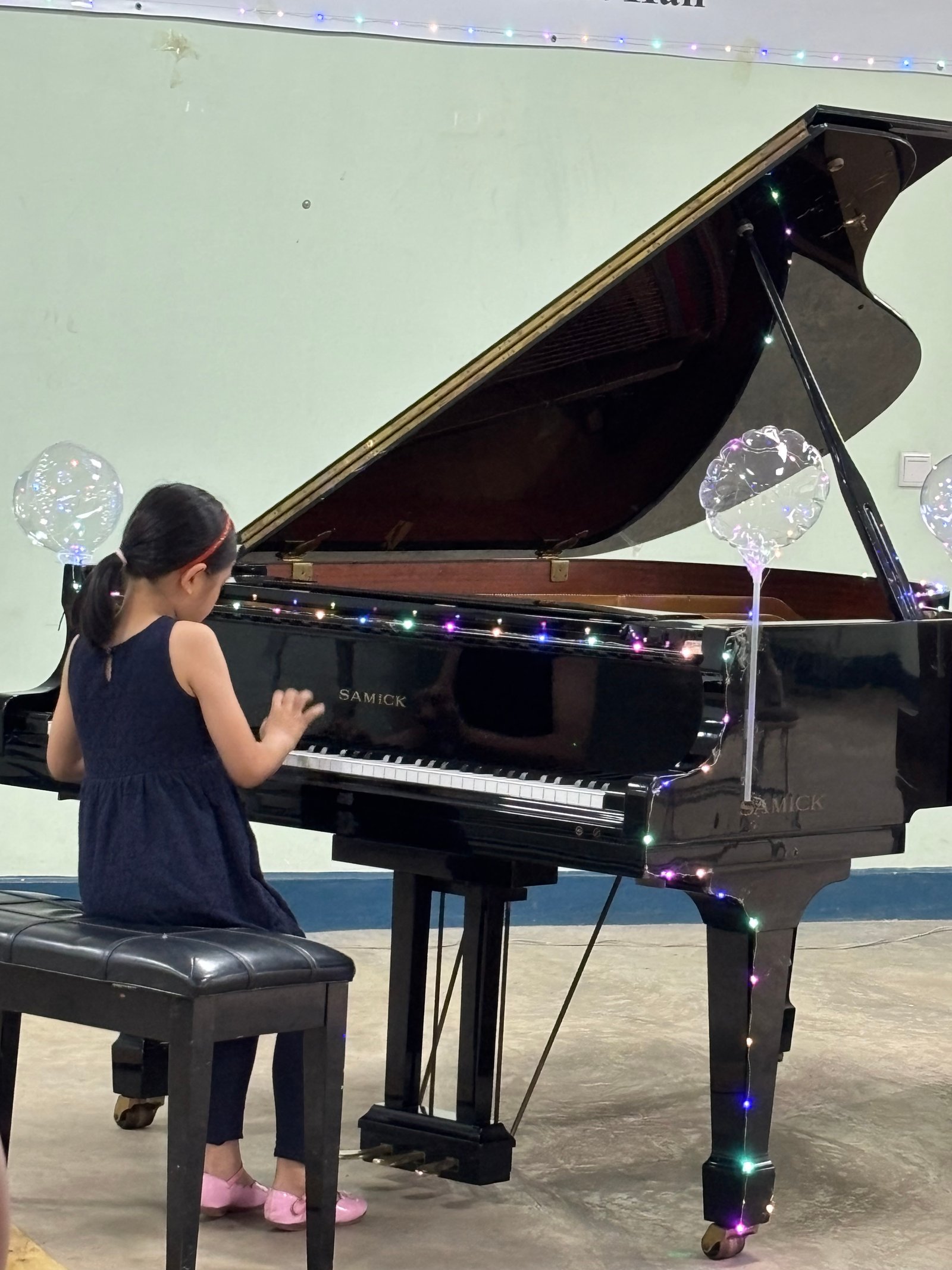 Young girl performing with concentration