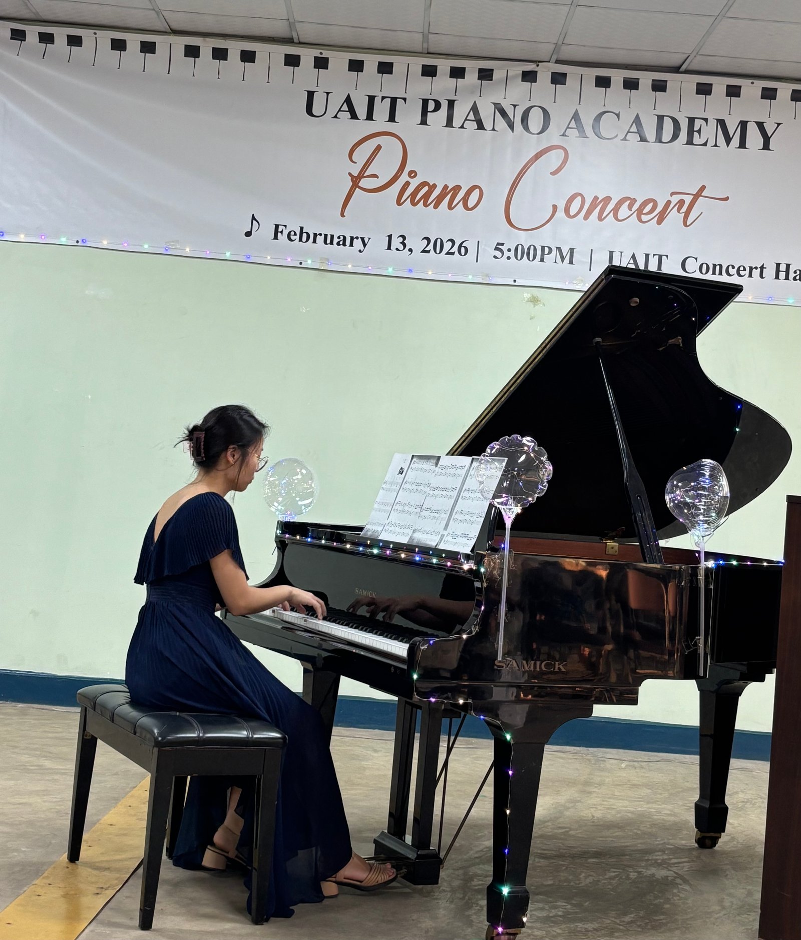 Instructor performing an elegant piece on the grand piano